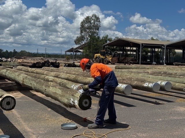 How utility poles are made: treatment cylinder, Koppers Wood Products, Grafton.